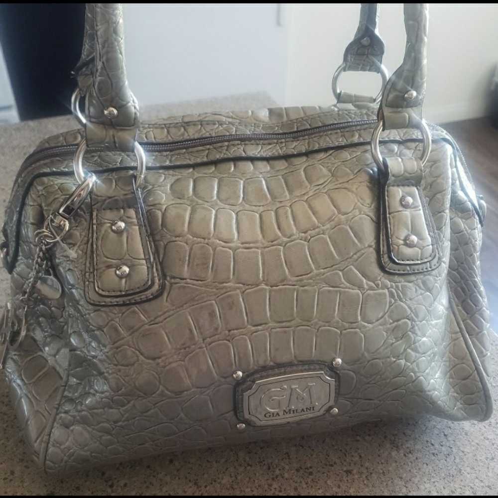 Gia Malani silver handbags